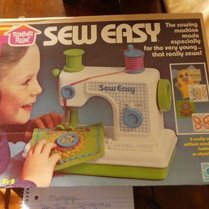 Vintage Romper Room Sew Easy Child's toy sewing machine.
